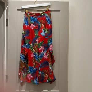 Tropical pant with mid thigh splits on both legs. High waisted
